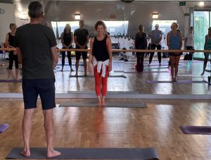 Lara in front of an in-person Pilates class